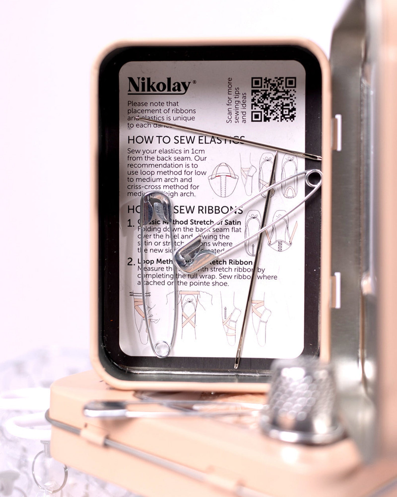 Nikolay sewing kit with instructions and tools on a white background