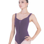 Ballerina wearing a purple leotard on a white background