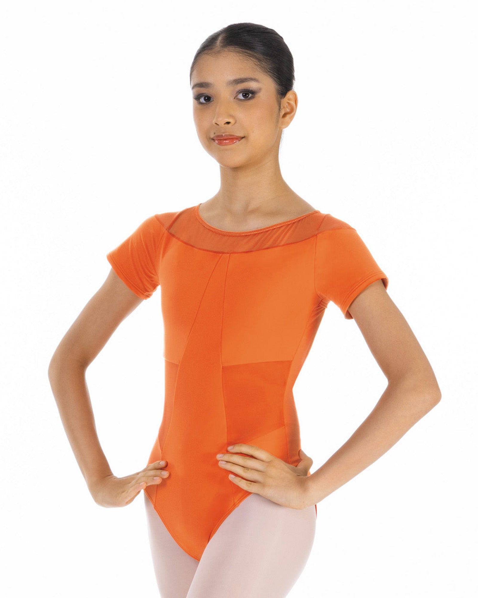 Woman wearing an orange ballet leotard on a white background