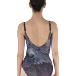 Person wearing a floral-patterned leotard on a white background