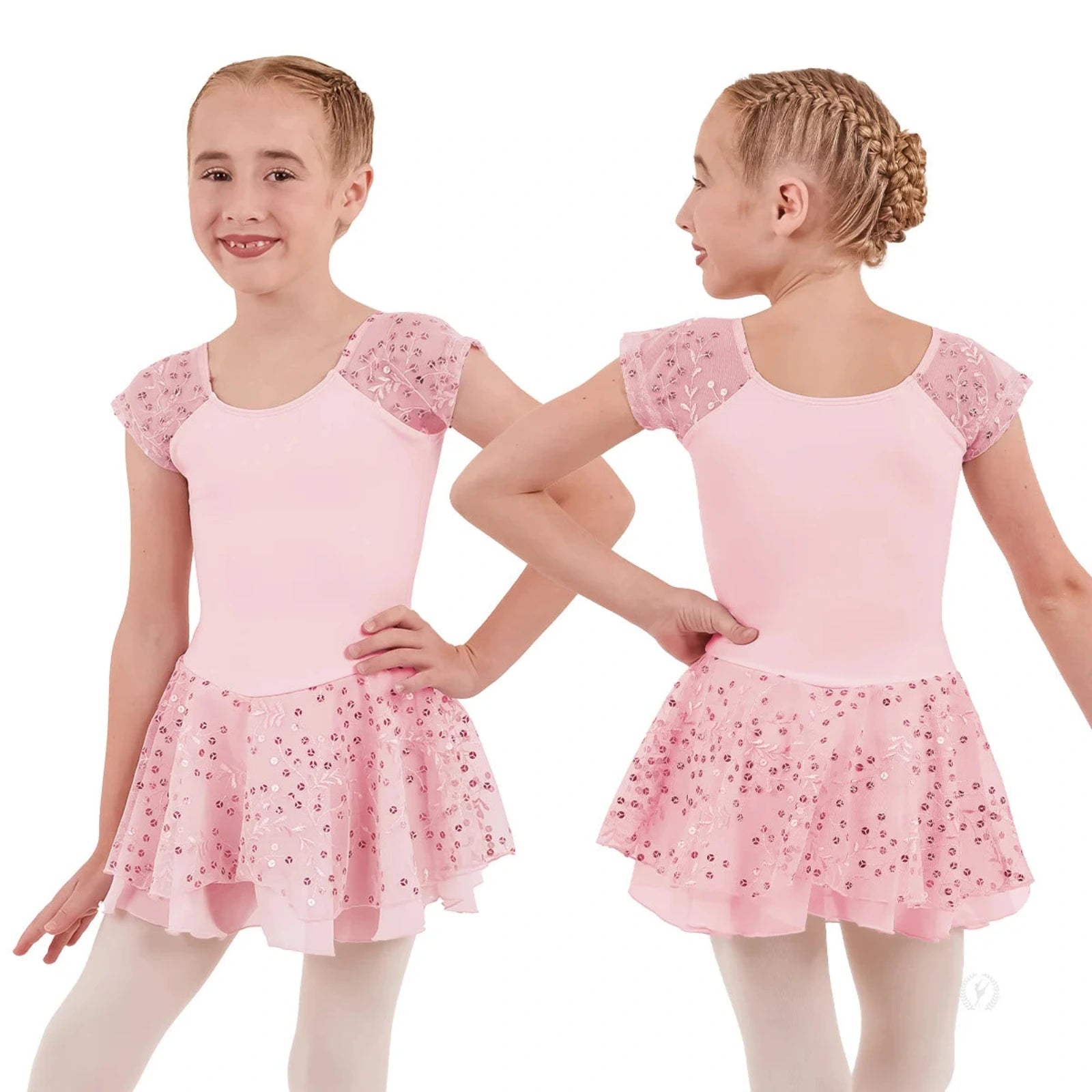 Young girl wearing a pink ballet dress with sequin details on a white background