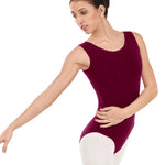 Ballerina in a burgundy leotard and pink tights on a white background
