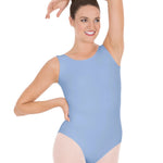 Woman wearing a light blue leotard on a white background