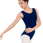 Woman wearing a navy blue leotard on a white background