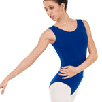 Dancer in a blue leotard and white tights on a white background