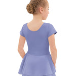 Young girl wearing a purple dress on a white background