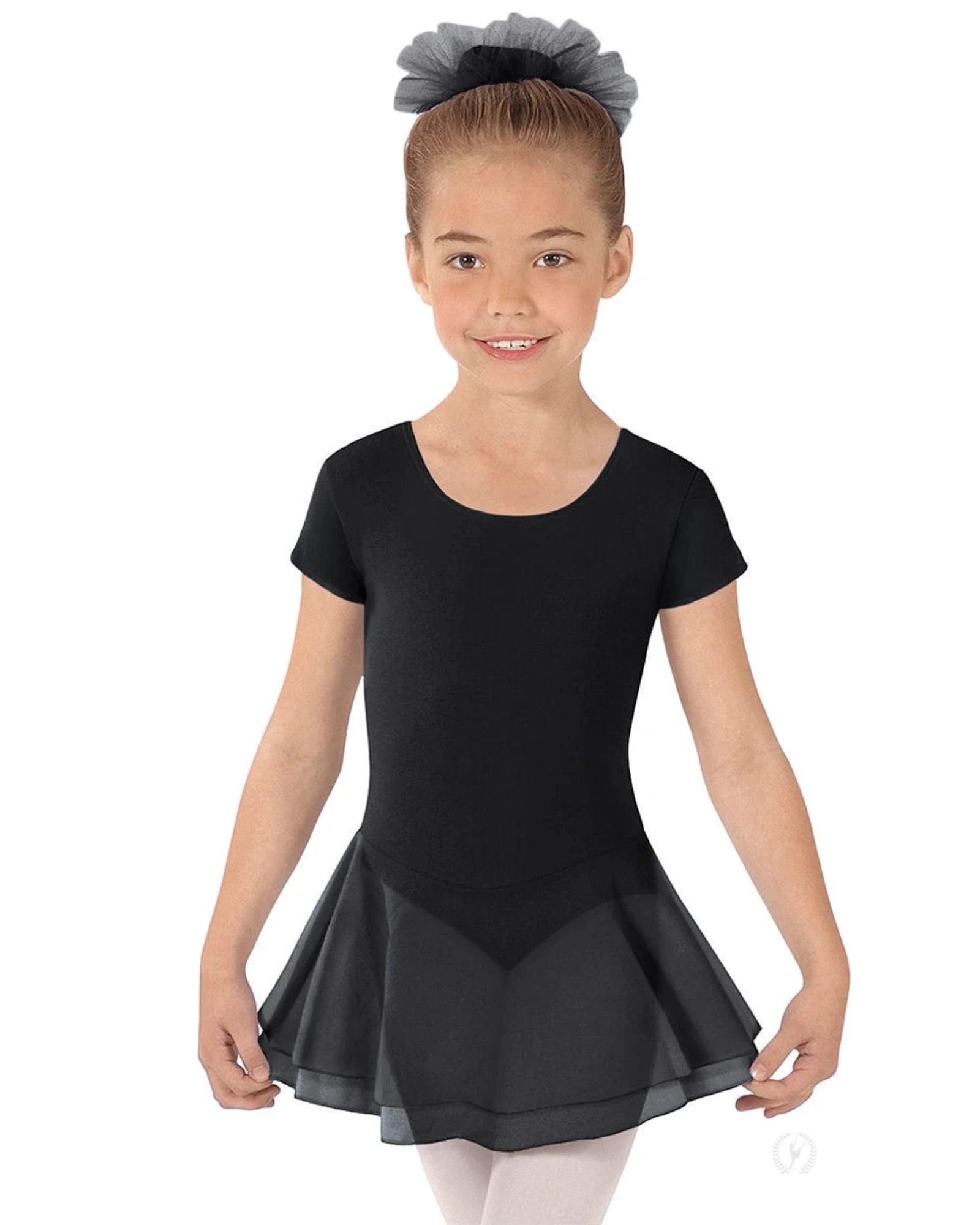 Young girl wearing a black ballet dress with a white background