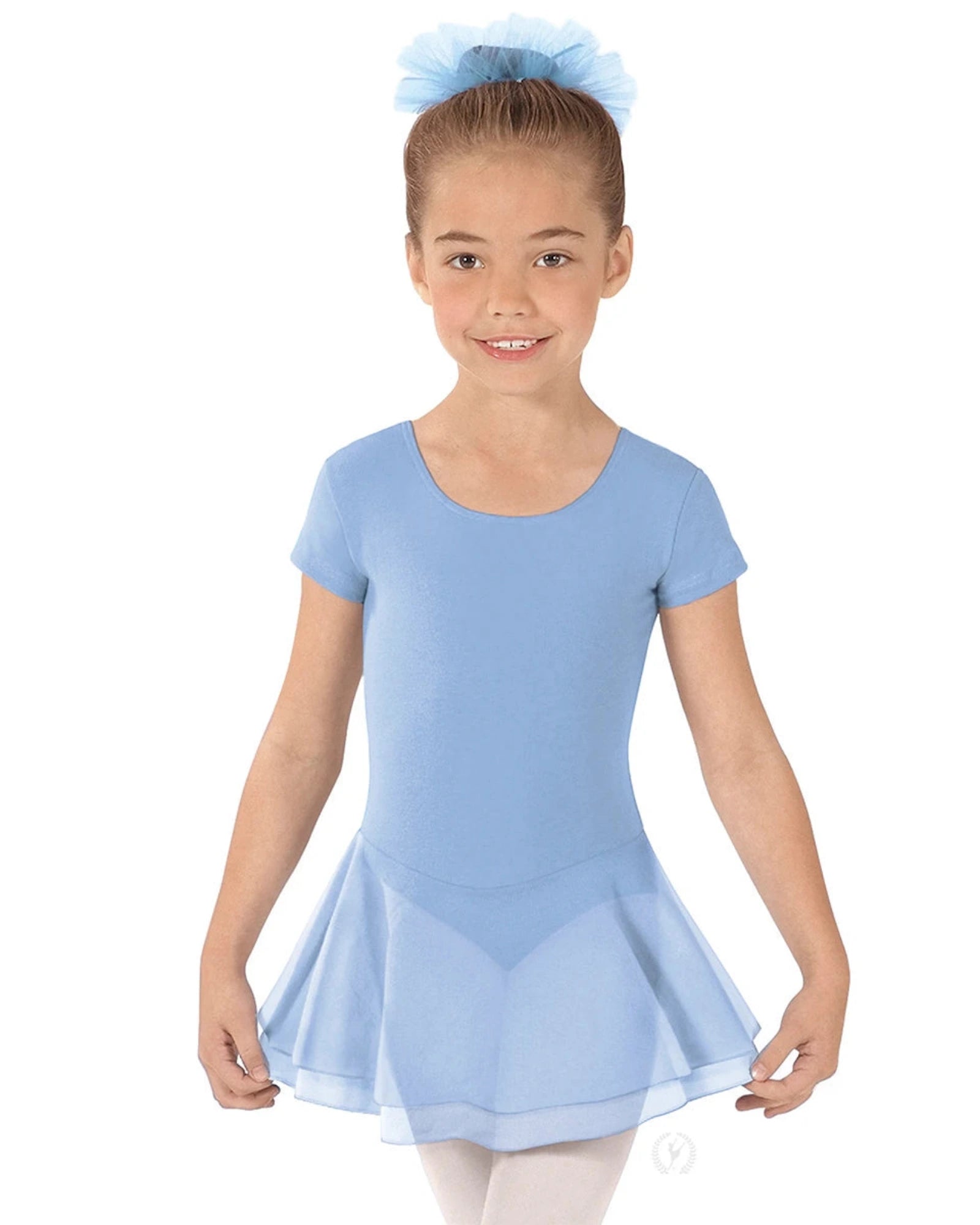 Young girl wearing a light blue dress with a white background