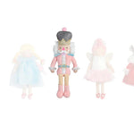 Set of four toy figurines in pastel colors on a white background