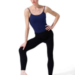 Dancer in a navy leotard and black sweater tights posing on a white background