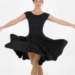 Dancer in a black dress with arms outstretched on a white background