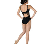 Dancer wearing a black leotard with cut-out design on a white background