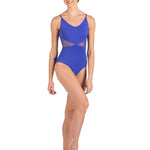 Woman wearing a blue leotard
 on a white background