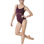Dancer in a maroon leotard posing on a white background