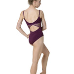 Dancer wearing a maroon leotard on a white background