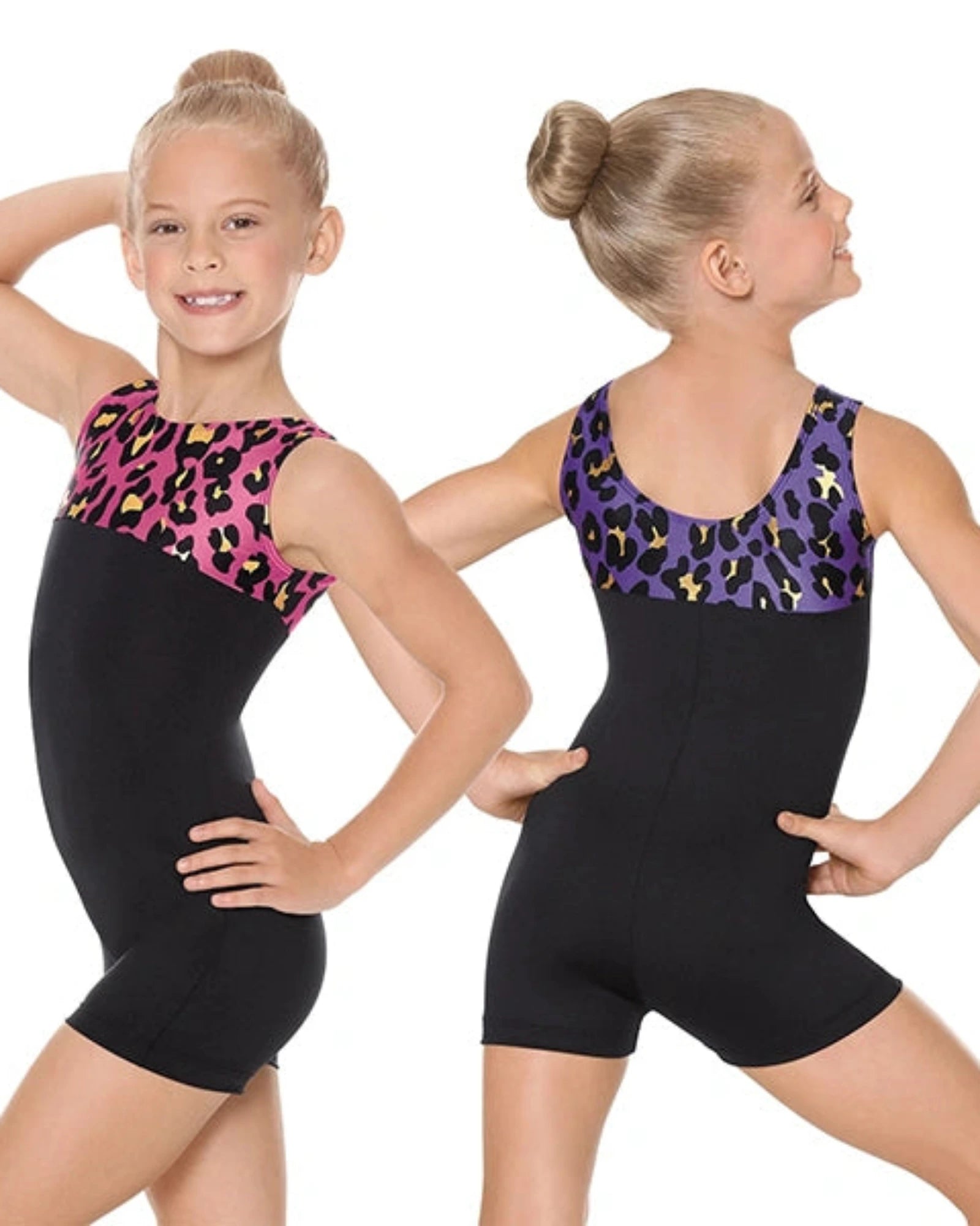 Two young girls wearing black leotards with patterned tops on a white background