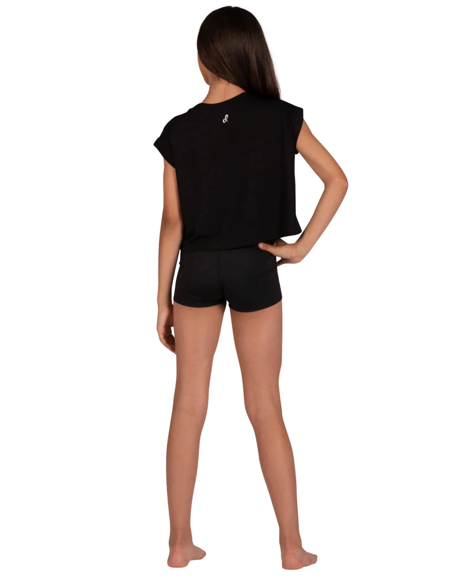 A child model shown from the back wearing a black short-sleeve crop top and black shorts against a plain white background.
