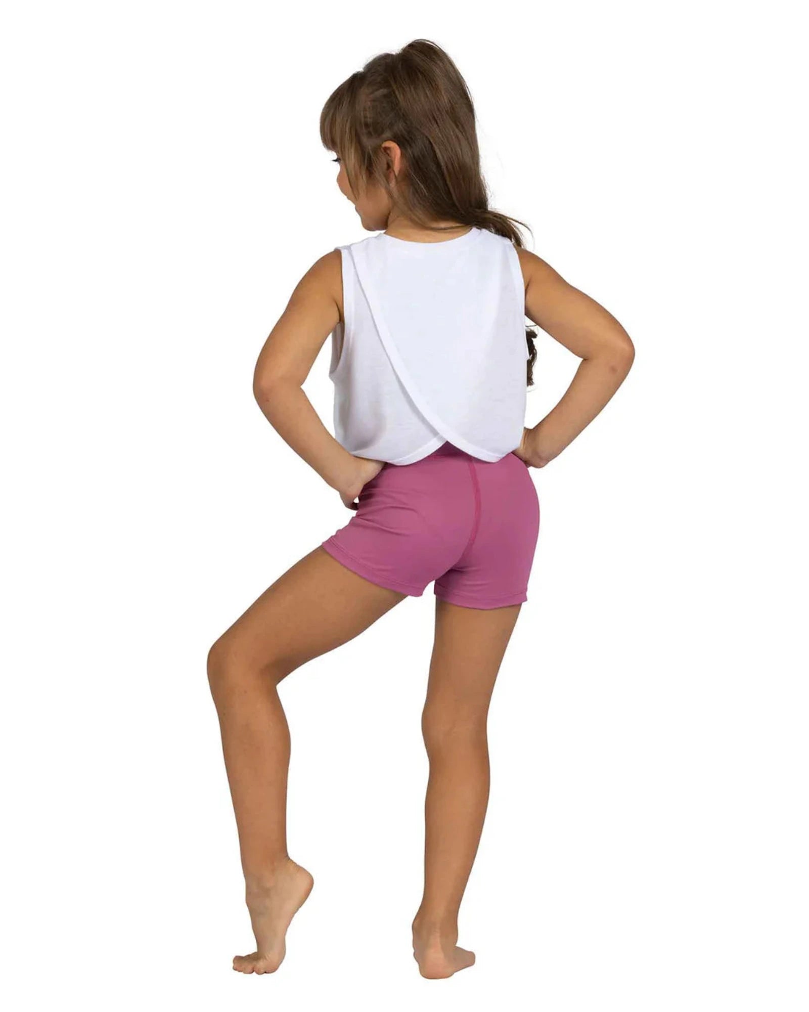 Person wearing a white sleeveless top and pink shorts on a white background