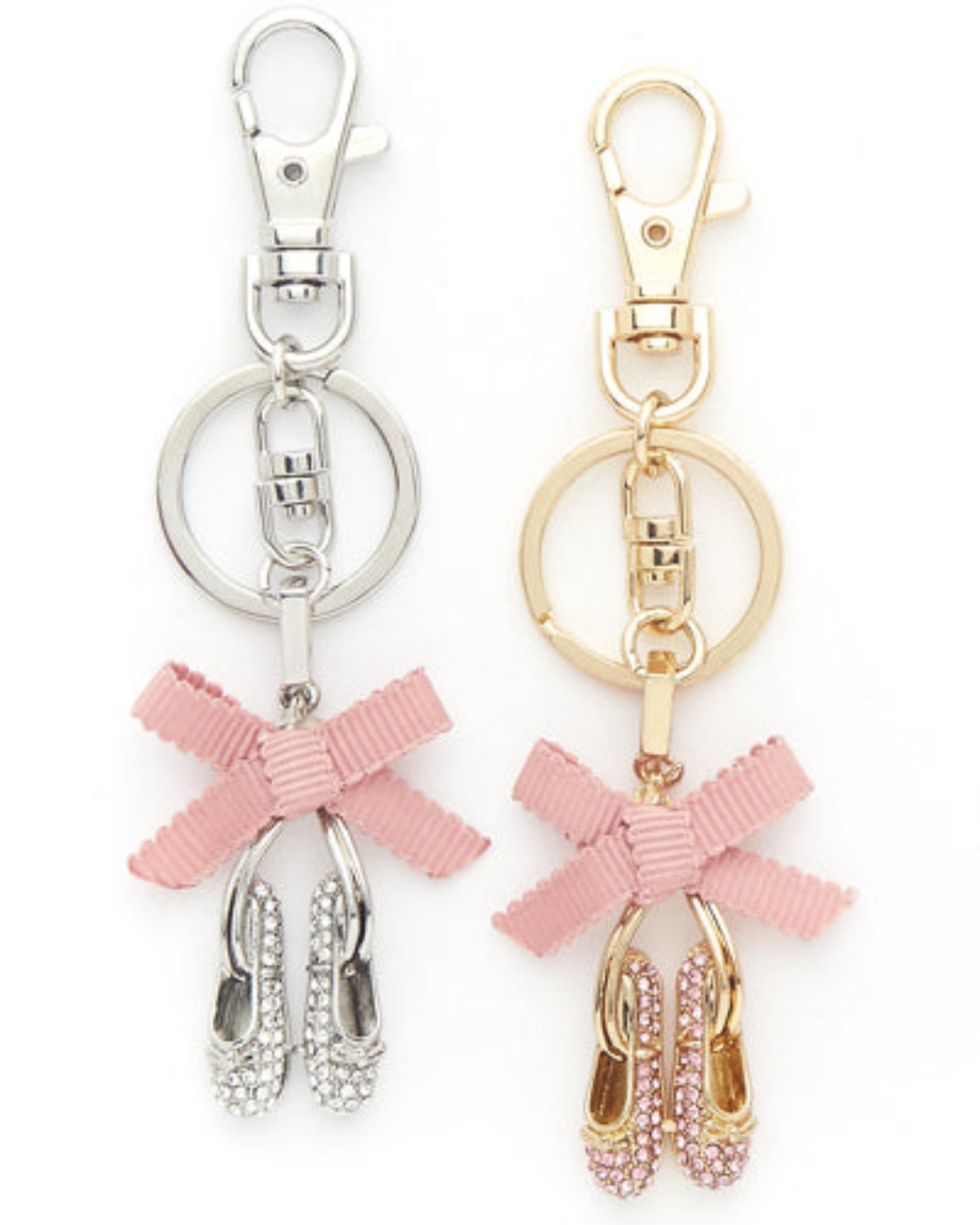 Two keychains with pink bows and shoe charms on a white background