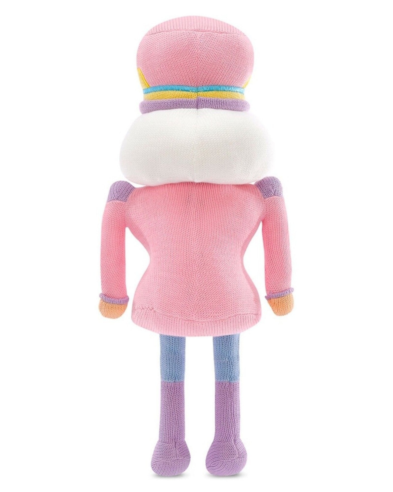 A plush toy doll shown from the back, wearing a pink knit outfit with a large white faux-fur collar, a pink hat with pastel stripes, lavender sleeves, blue legs, and purple boots, on a white background.
