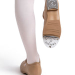 Tan tap shoe with 'Capezio' logo worn on a white background