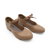 Pair of tan shoes with a bow on a white background