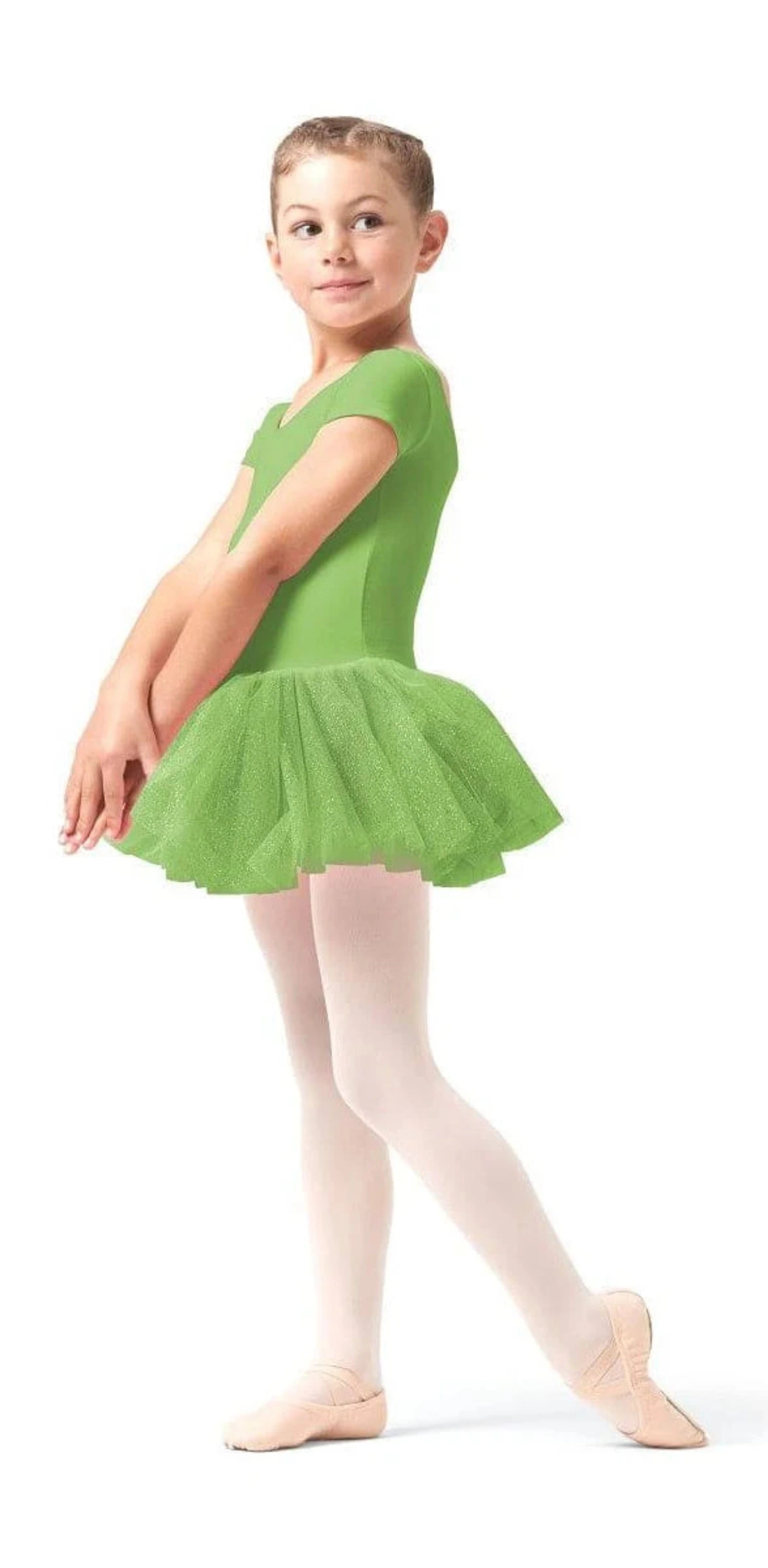 Young girl in a green ballet dress on a white background