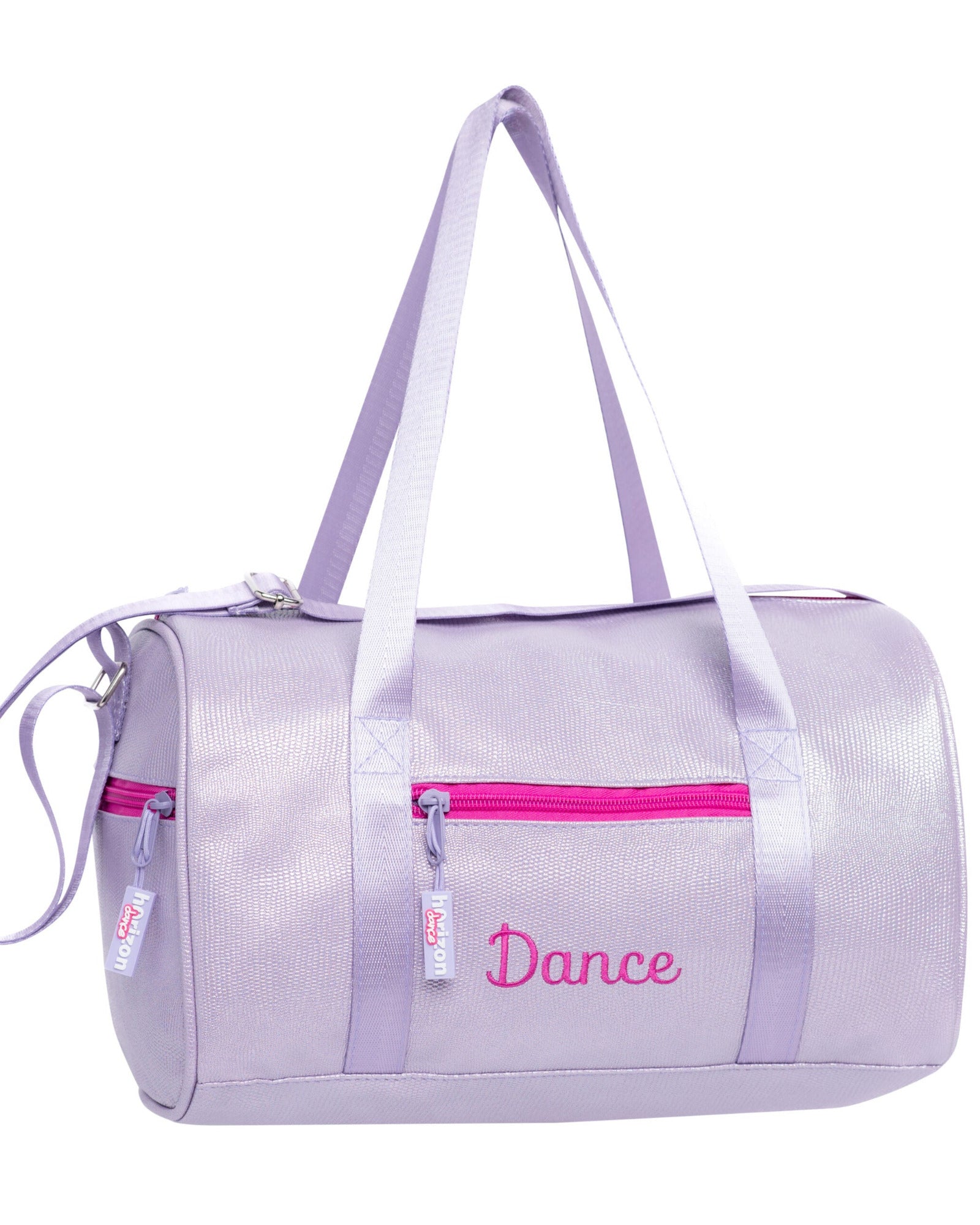A lavender purple dance bag with a shiny finish, featuring a bright pink zipper, a pink embroidered 'Dance' script on the front, and dual shoulder straps, shown on a plain white background.