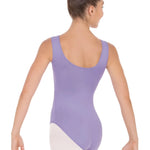 Woman wearing a purple leotard on a white background