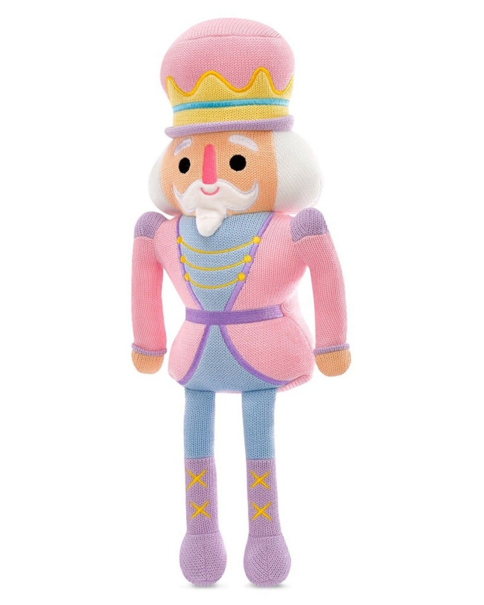 A plush nutcracker doll with a pink and lavender outfit, yellow accents, and a white beard, standing against a plain white background.