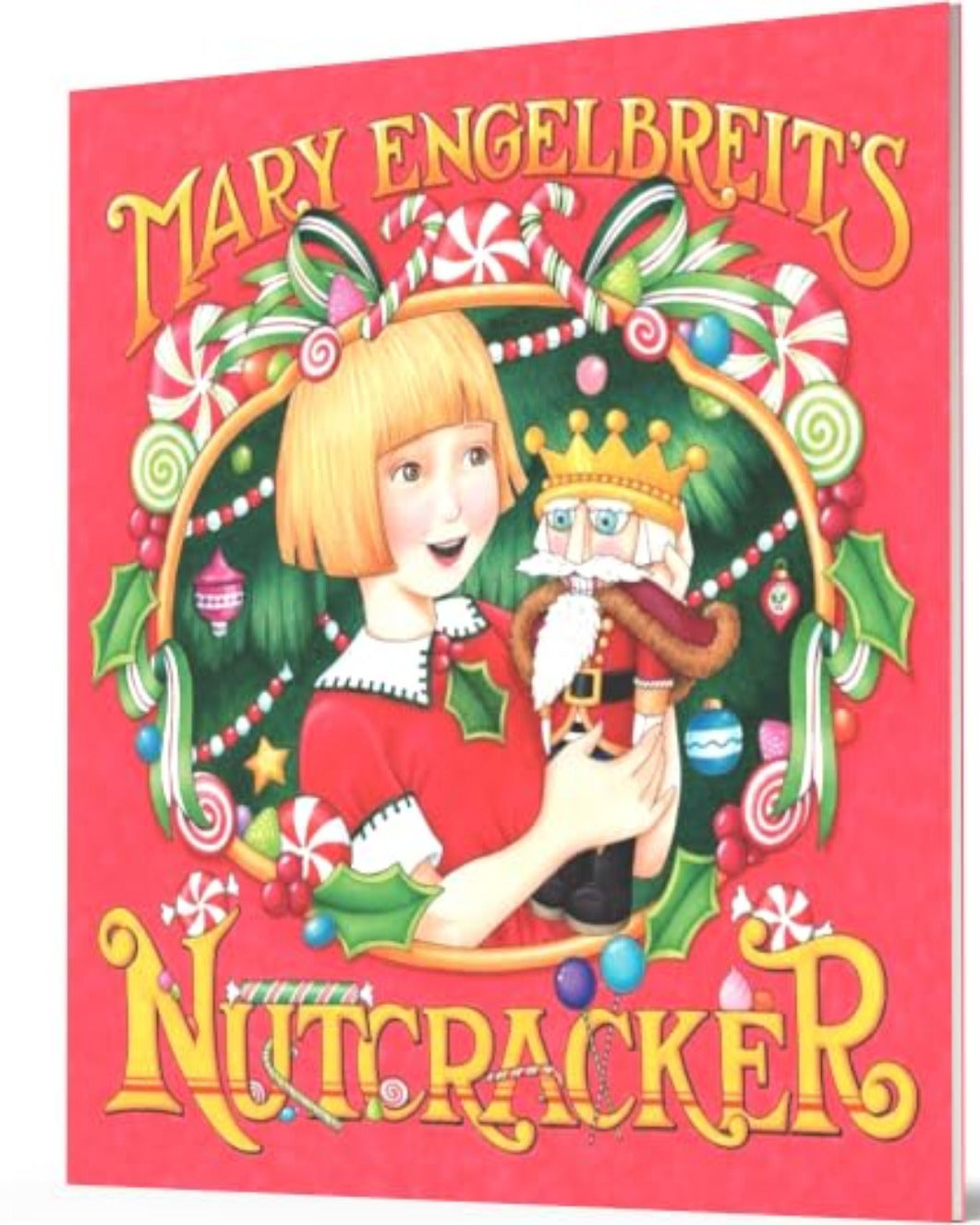 A square book cover for Mary Engelbreit's Nutcracker, featuring a festive red background with an illustrated blonde girl in a red dress holding a nutcracker, surrounded by candy canes, holly, and green garlands. The title text is in large yellow letters at the top and bottom.