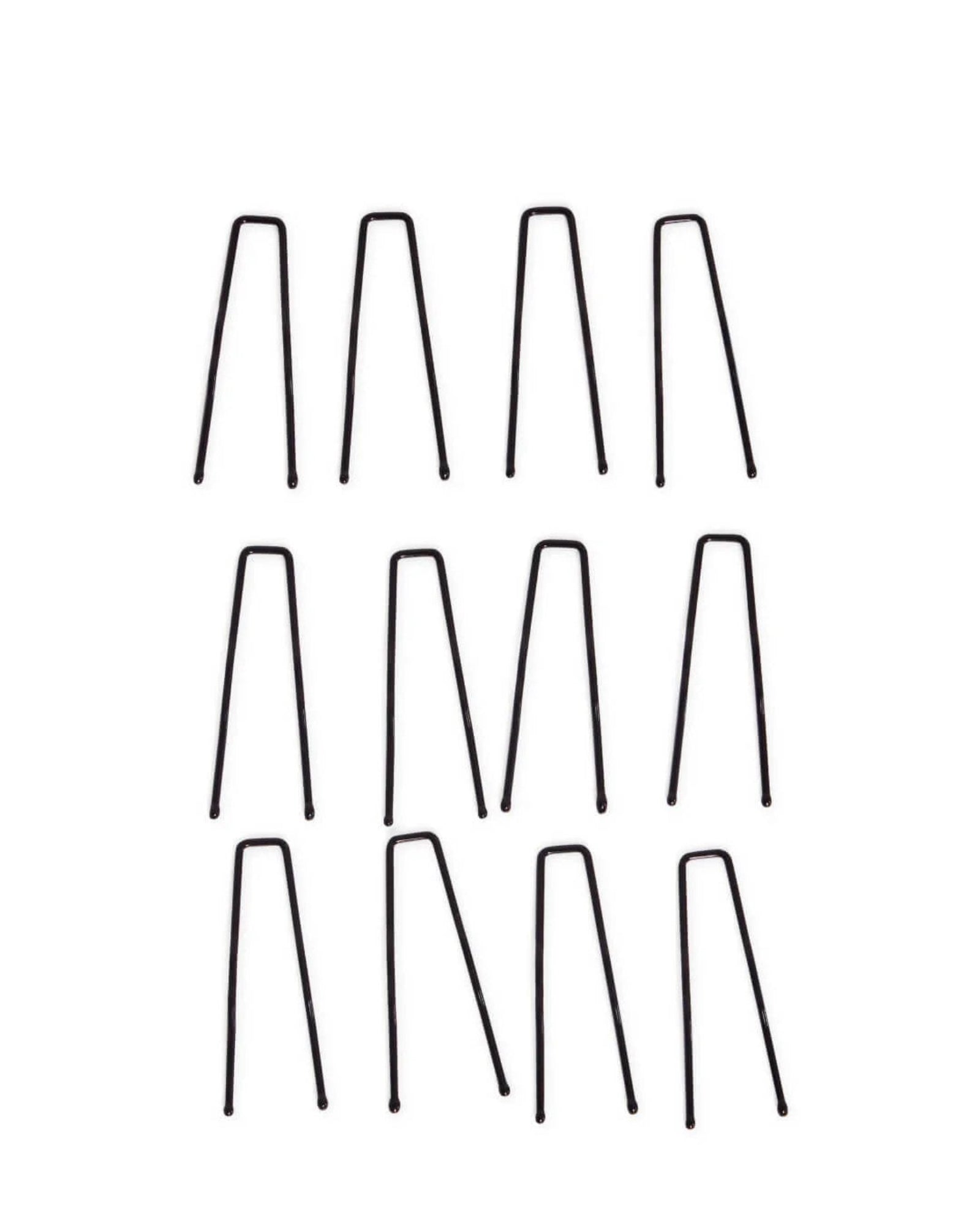 Set of black hair clips on a white background