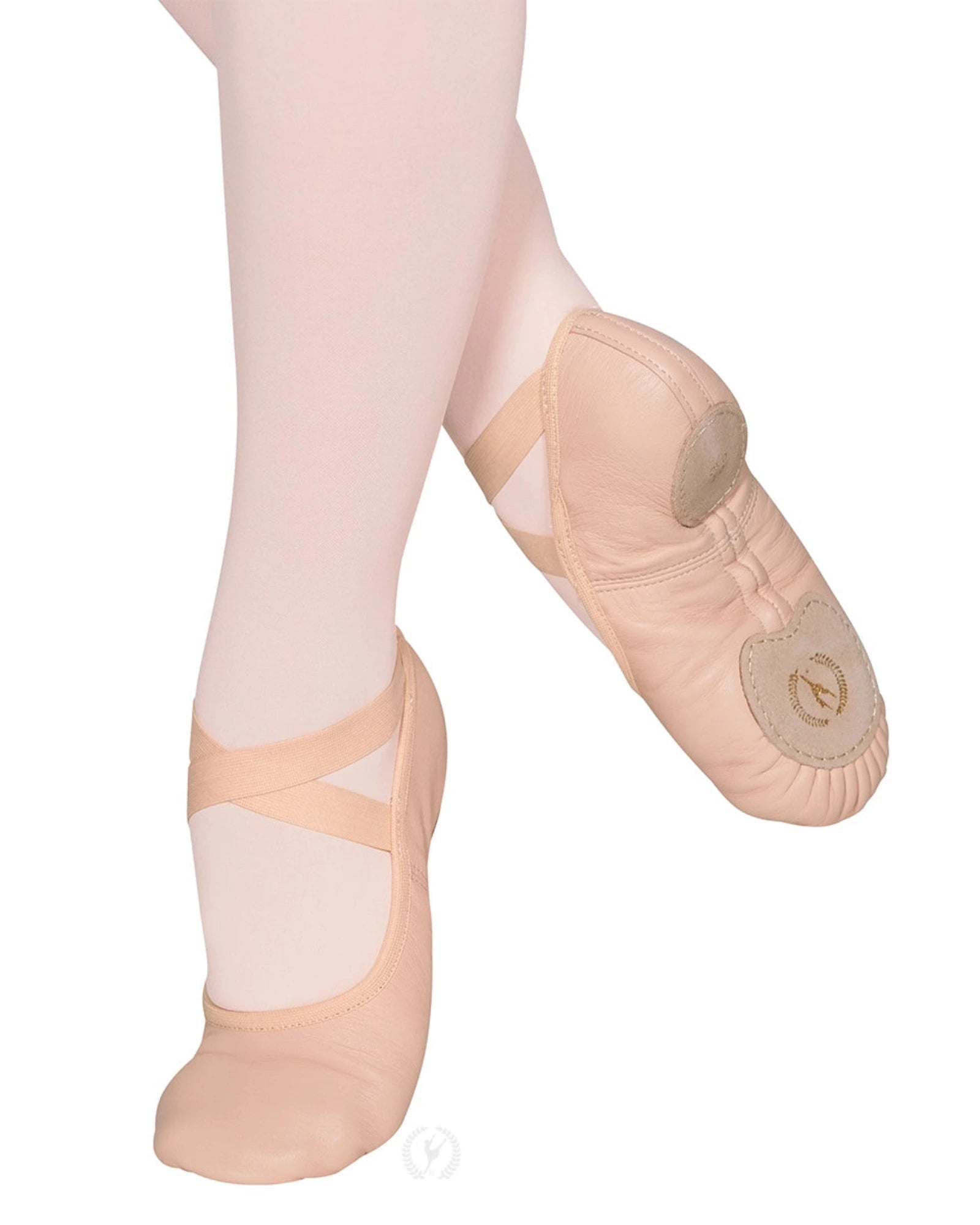 Ballet shoes worn with pink tights on a white background