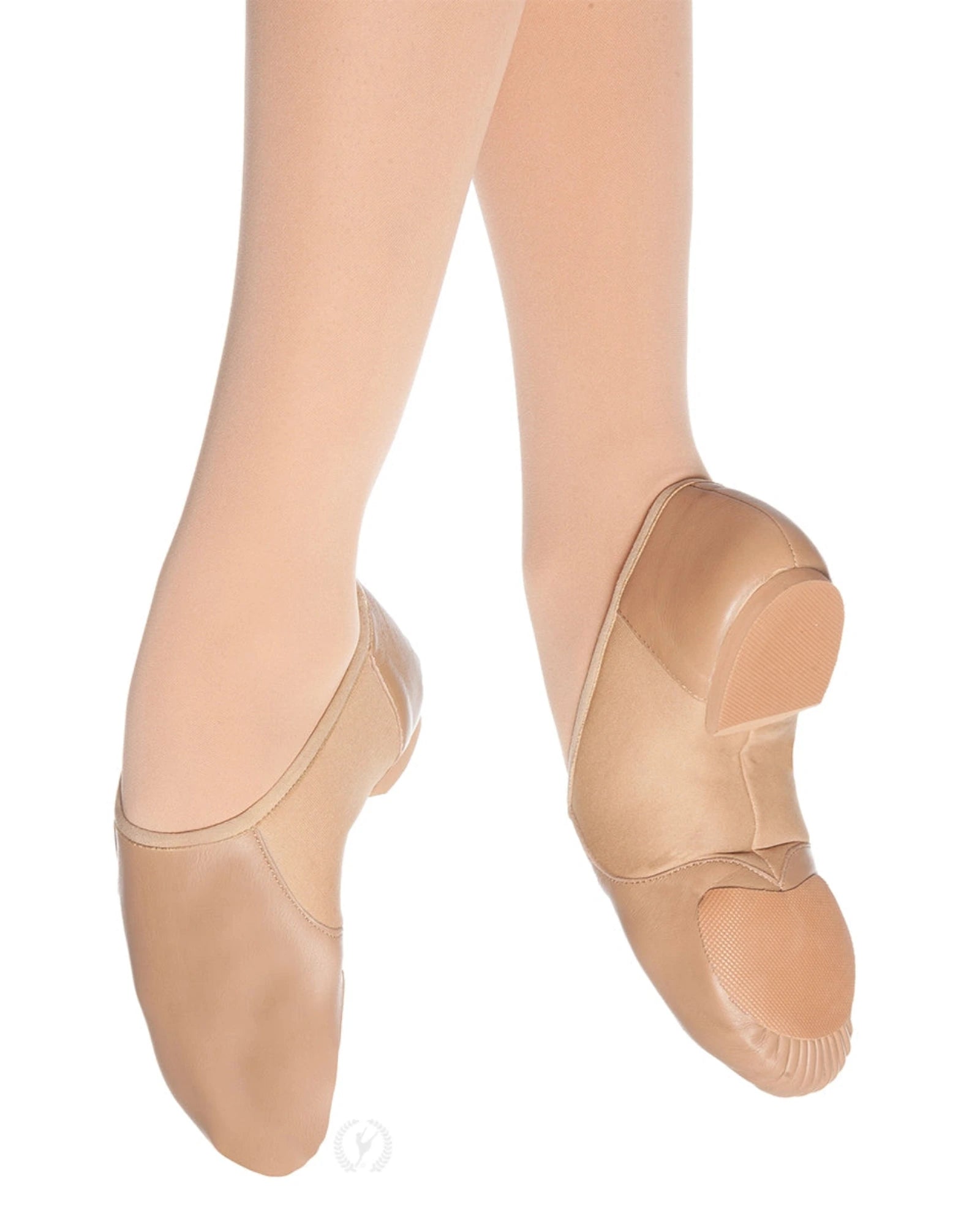 Beige jazz shoes worn with tights on a white background