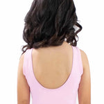 Person wearing a pink dress with a white background