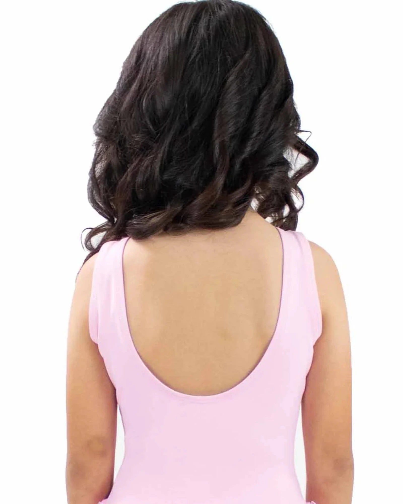 Person wearing a pink dress with a white background