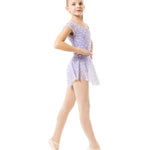 A young girl dancer posing in a sleeveless lavender and white patterned leotard with pink tights and ballet slippers against a solid white background.