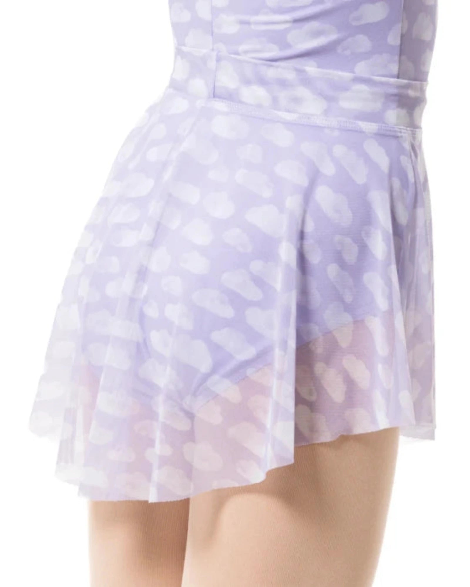 A close-up of a model wearing a lavender and white patterned mesh skirt with a sheer underlayer, shown from the waist down against a white background.