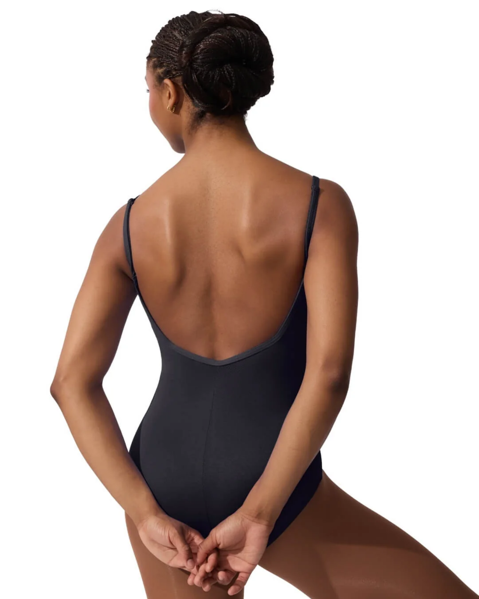 Person wearing a black leotard on a white background