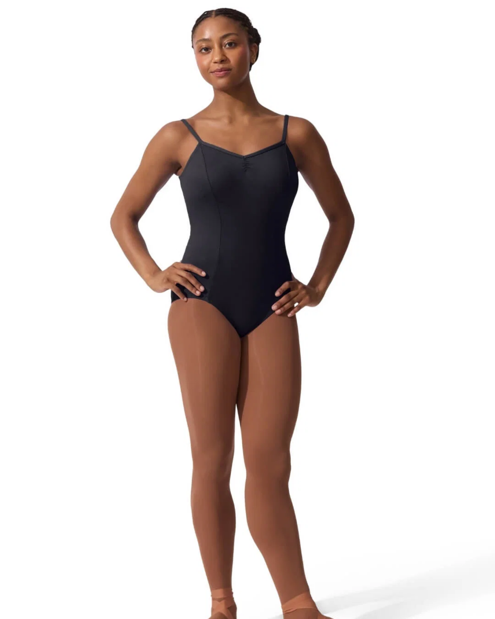 Person wearing a black leotard and brown tights on a white background