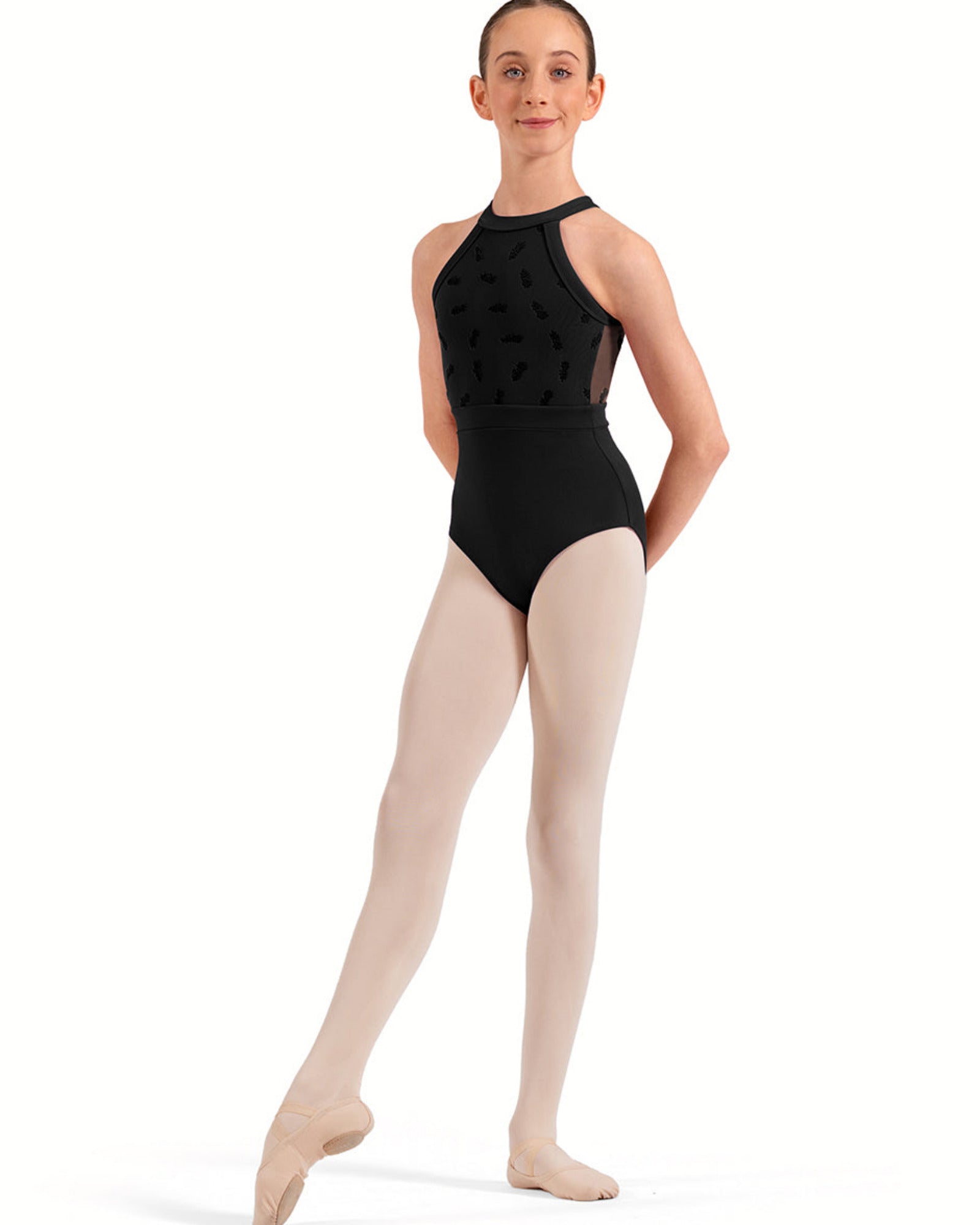 Ballerina wearing a black leotard and pink tights on a white background