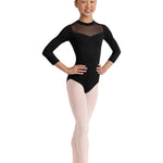 Ballet dancer in a black leotard with sheer mesh panels on a white background