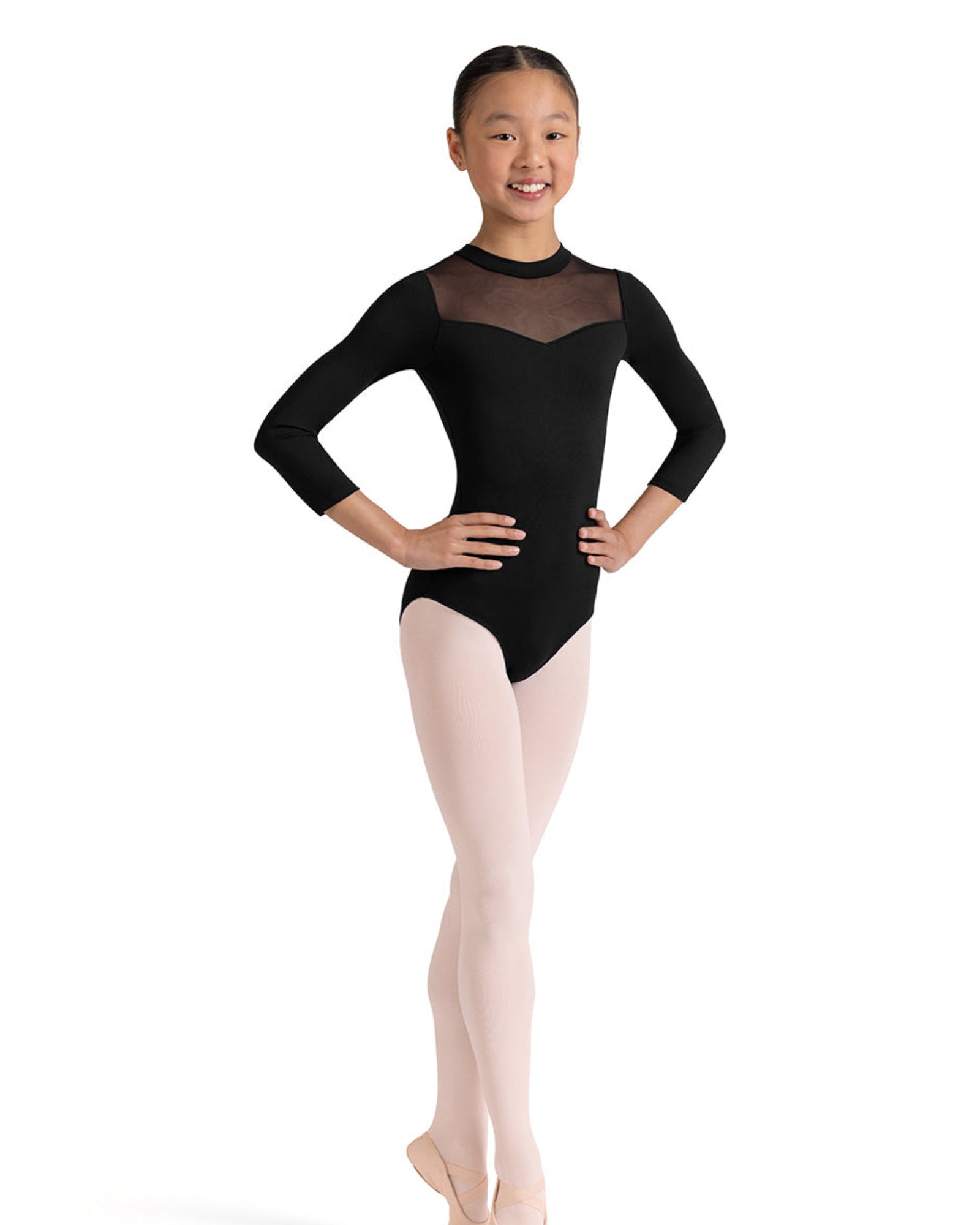 Ballet dancer in a black leotard with sheer mesh panels on a white background