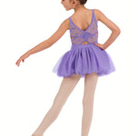 Young girl in a purple ballet dress on a white background