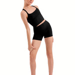 Person wearing a black tank top and shorts on a white background