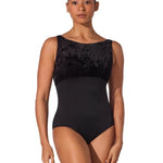 Woman wearing a black leotard with a textured top on a white background