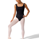 Dancer in a black leotard and pink tights on a white background