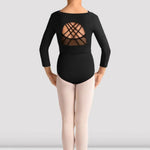 Young person wearing a black strappy open back crop top design on a plain background