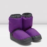 Purple and black booties on a white background