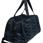 A black duffel bag with a repeating light blue 'DANCE' text pattern, featuring dual top handles and a zippered main compartment, shown against a plain white background.